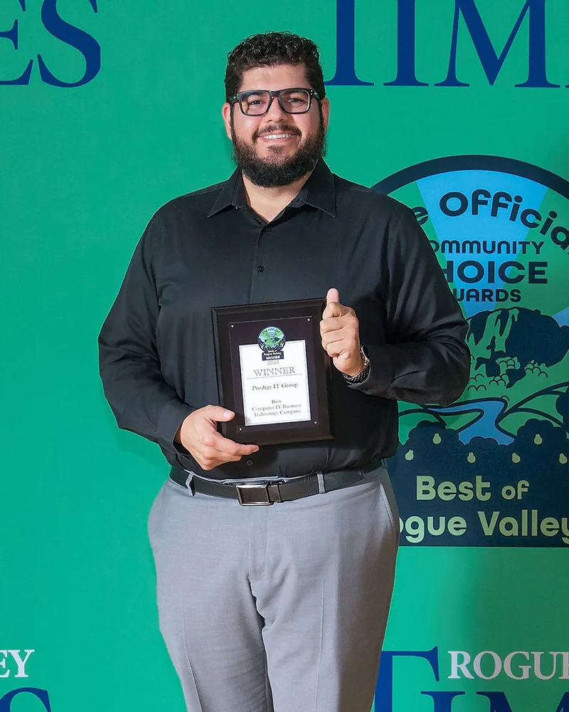 Andrew Martinez holding the Best of Rogue Valley 2026 award plaque at the Rogue Valley Times Community Choice Awards.